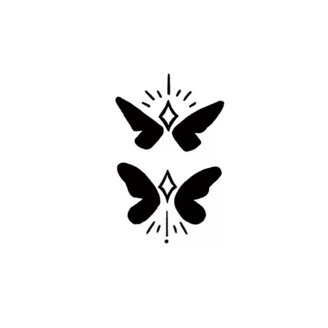 Temporary tattoo design of two butterflies with sparkling details.